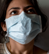 image of a person wearing a disposable medical mask